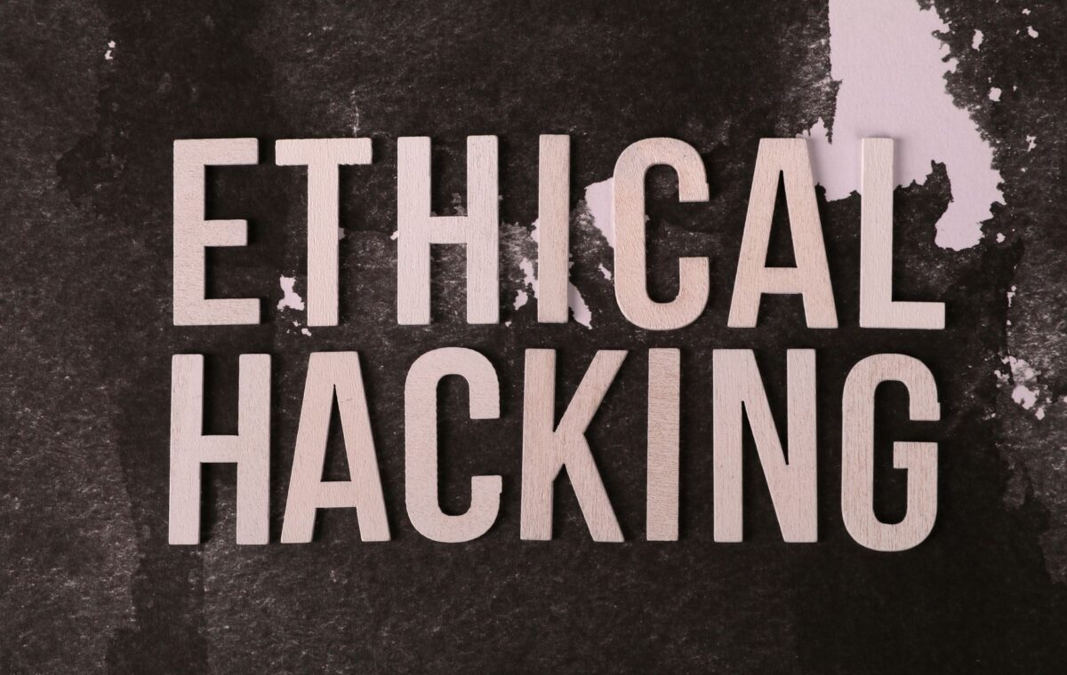 Creative composition with 'Ethical Hacking' text on textured background for cybersecurity theme.